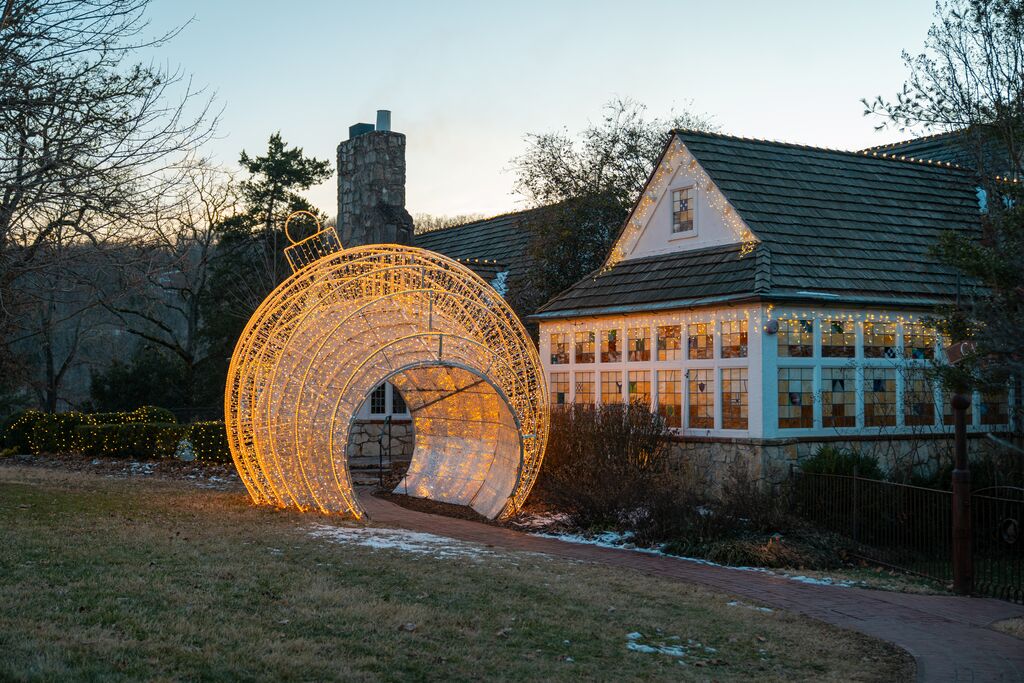 Big Cedar Lodge, in Ridgedale, is decorated with holiday lights and winter decorations, and features a walkway passing through what's made to look like a Christmas tree ornament.