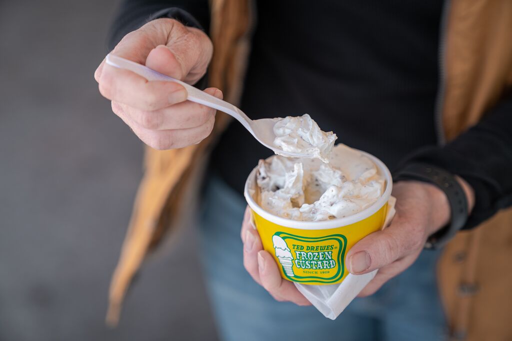 Hand holds a cup of famous Ted Drewes Frozen Custard.