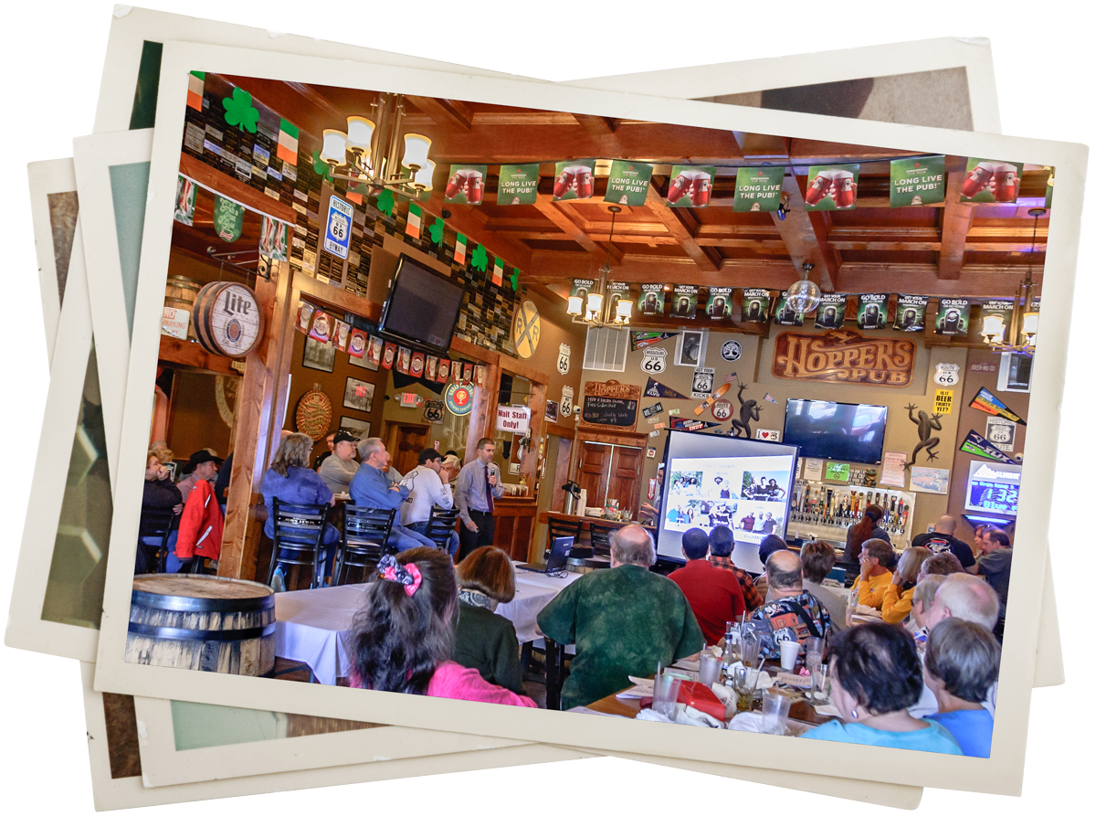 the inside of a pub full of people sitting at tables